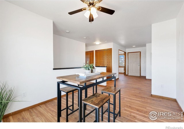 dining area featuring ceiling fan and light hardwood / wood-style floors