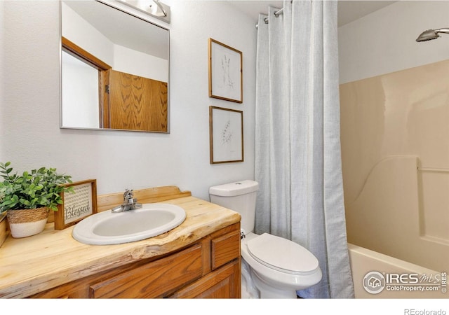 full bathroom with toilet, shower / bath combo, and vanity