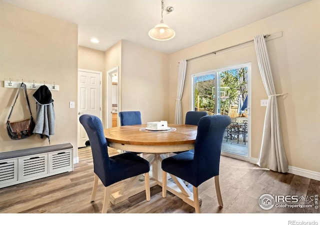 dining space featuring hardwood / wood-style flooring