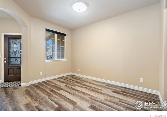 foyer entrance featuring hardwood / wood-style floors