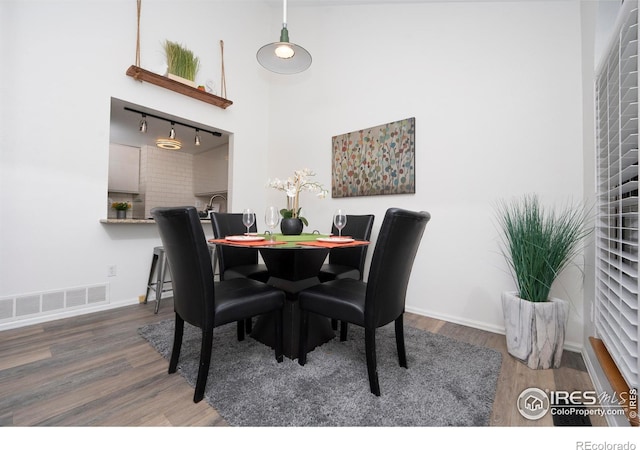 dining space featuring hardwood / wood-style flooring