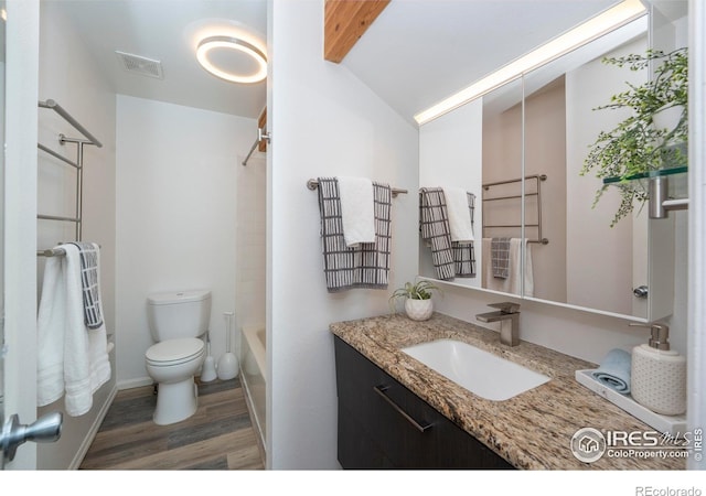 full bathroom with toilet, tub / shower combination, lofted ceiling with beams, vanity, and hardwood / wood-style flooring