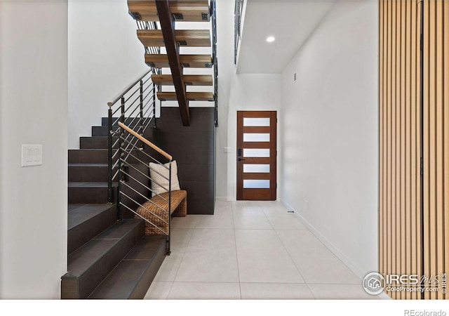 entryway featuring light tile patterned flooring