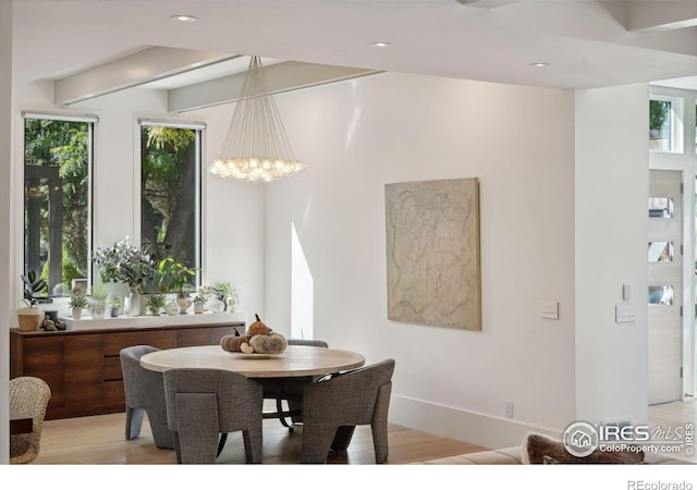 dining space featuring a notable chandelier