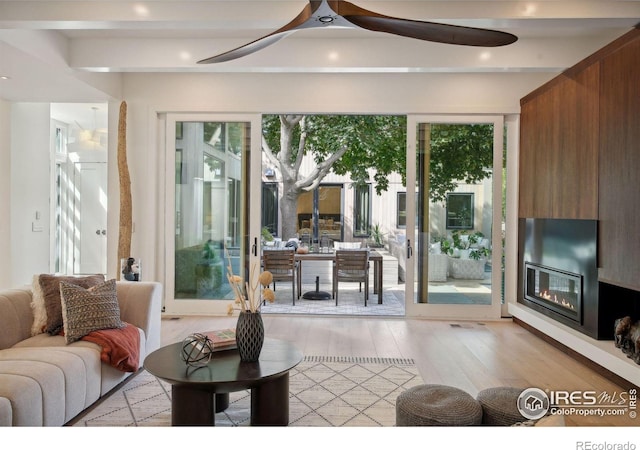 entryway with ceiling fan and light wood-type flooring