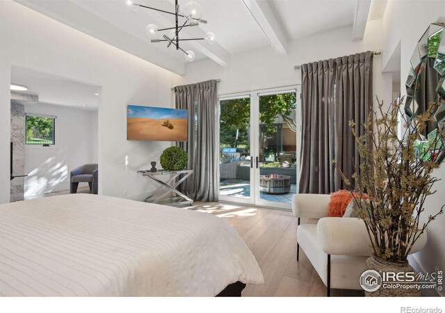 bedroom with access to outside, hardwood / wood-style floors, beamed ceiling, and multiple windows