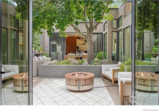 view of patio / terrace with a fire pit