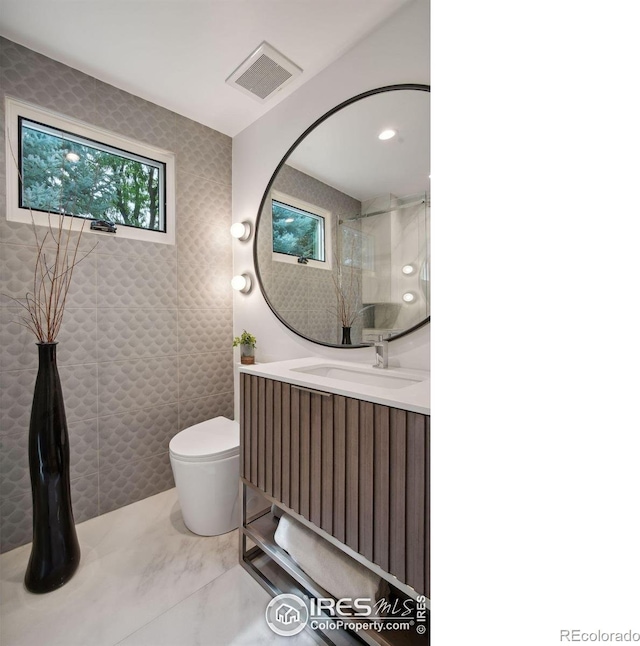 bathroom with vanity and toilet