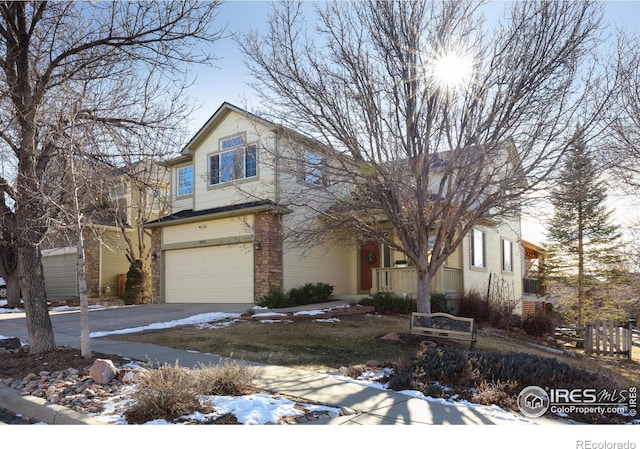 view of front of property with aphalt driveway and an attached garage