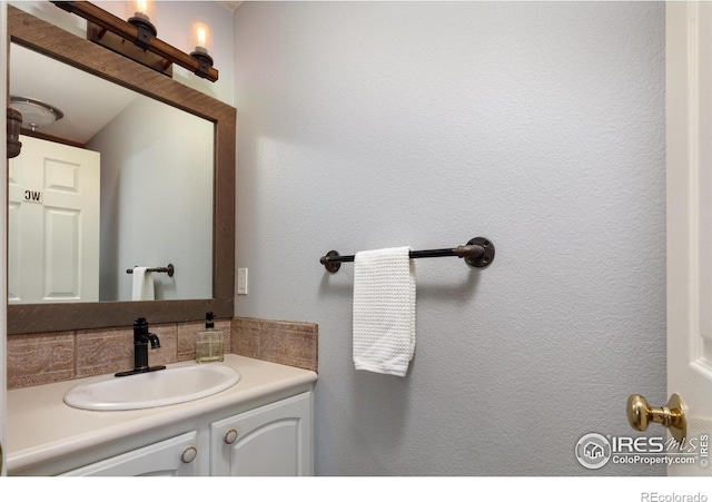 bathroom with vanity and backsplash