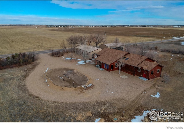 birds eye view of property with a rural view