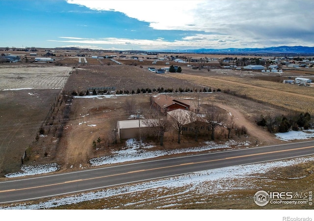 drone / aerial view featuring a mountain view and a rural view