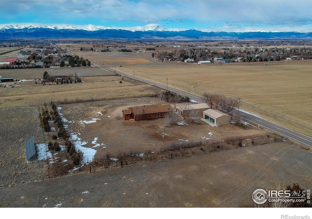 birds eye view of property featuring a mountain view and a rural view