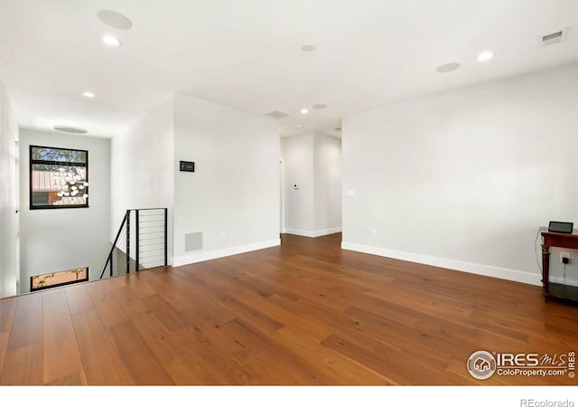 unfurnished living room with hardwood / wood-style floors