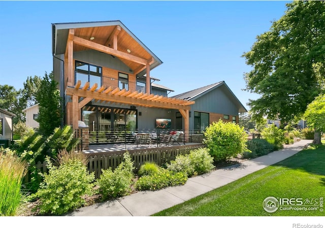 back of house with a pergola