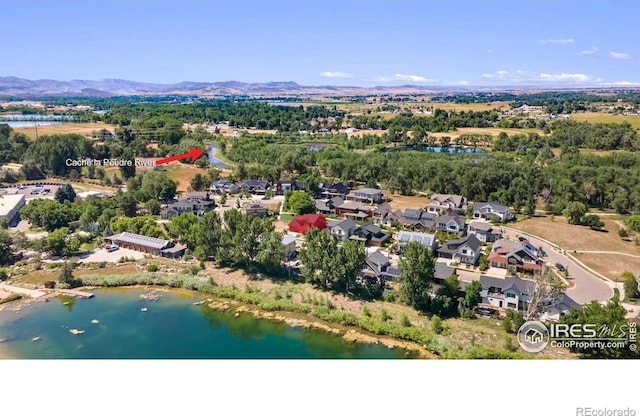 bird's eye view featuring a water and mountain view