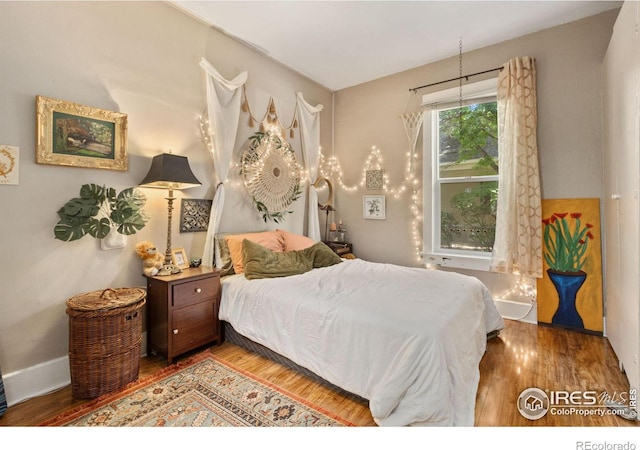 bedroom featuring hardwood / wood-style flooring