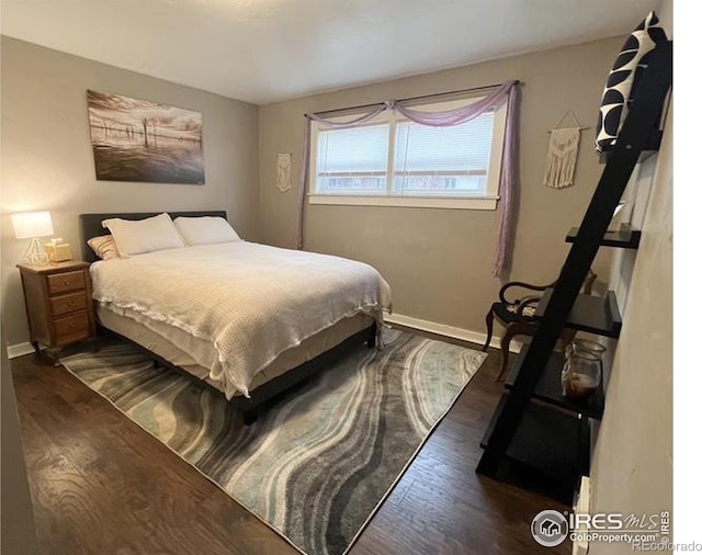 bedroom featuring dark hardwood / wood-style flooring