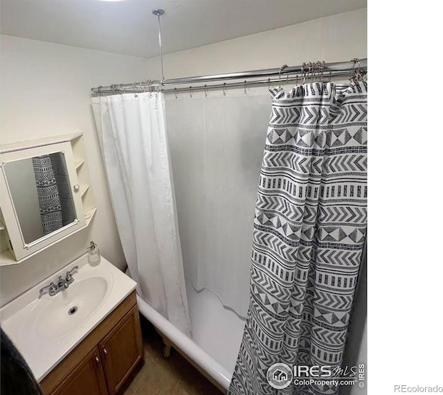 bathroom with tile patterned floors and vanity