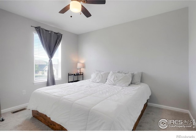 bedroom with light colored carpet and ceiling fan