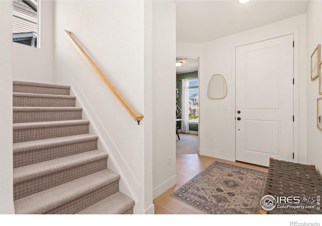 foyer entrance with light wood-type flooring