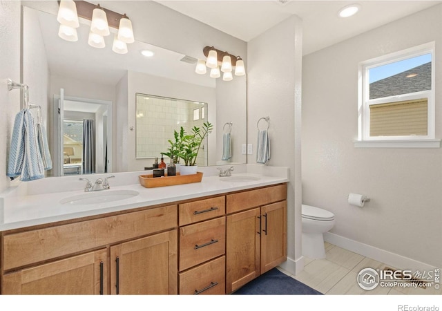 bathroom with walk in shower, tile patterned flooring, vanity, and toilet