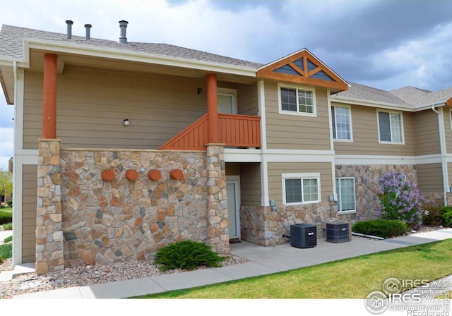 view of front of property featuring central AC unit