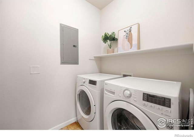 laundry area with electric panel and washing machine and dryer