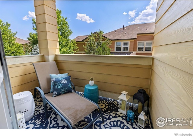 view of patio featuring a balcony