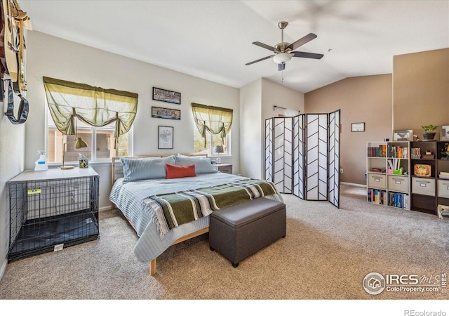 bedroom featuring vaulted ceiling, carpet floors, and ceiling fan