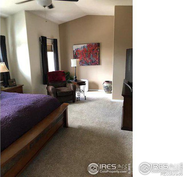 bedroom featuring ceiling fan, vaulted ceiling, and carpet floors