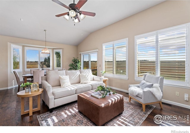 living room featuring ceiling fan, vaulted ceiling, and dark hardwood / wood-style floors