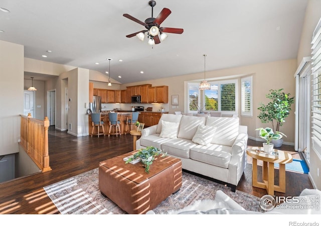 living room featuring lofted ceiling, dark hardwood / wood-style flooring, and ceiling fan