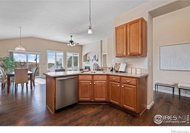 kitchen featuring sink, hanging light fixtures, stainless steel dishwasher, and ceiling fan