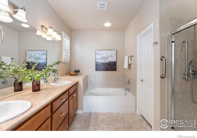 bathroom featuring shower with separate bathtub and vanity