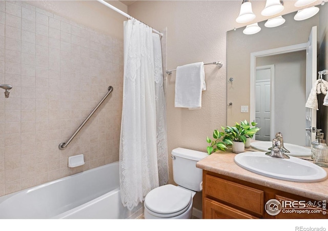 full bathroom featuring shower / bathtub combination with curtain, vanity, and toilet