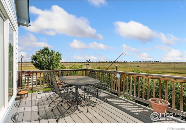 wooden deck featuring a rural view