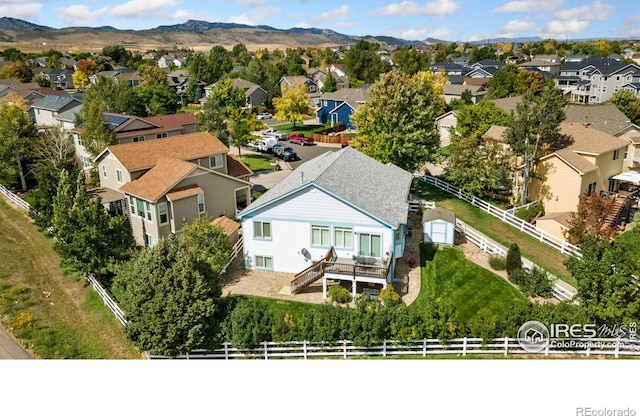 birds eye view of property featuring a mountain view