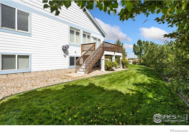 view of yard featuring a wooden deck