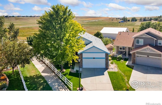 birds eye view of property featuring a rural view