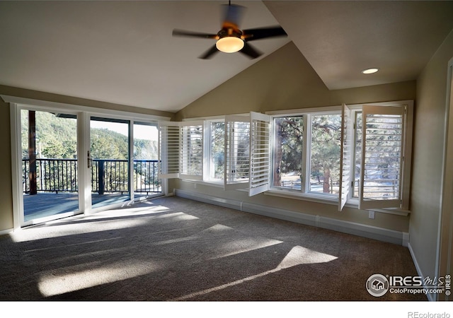 unfurnished sunroom with vaulted ceiling and ceiling fan