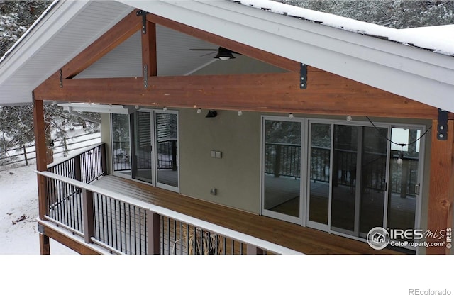 exterior space with ceiling fan