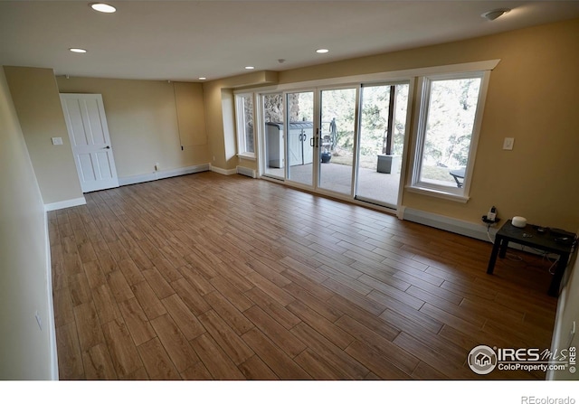 unfurnished room featuring hardwood / wood-style flooring