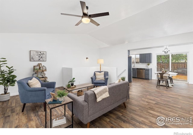 living room with ceiling fan, dark hardwood / wood-style flooring, and lofted ceiling