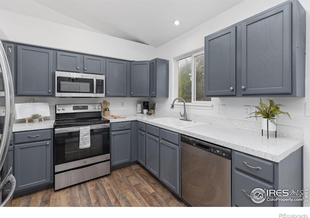 kitchen with stainless steel appliances and gray cabinets