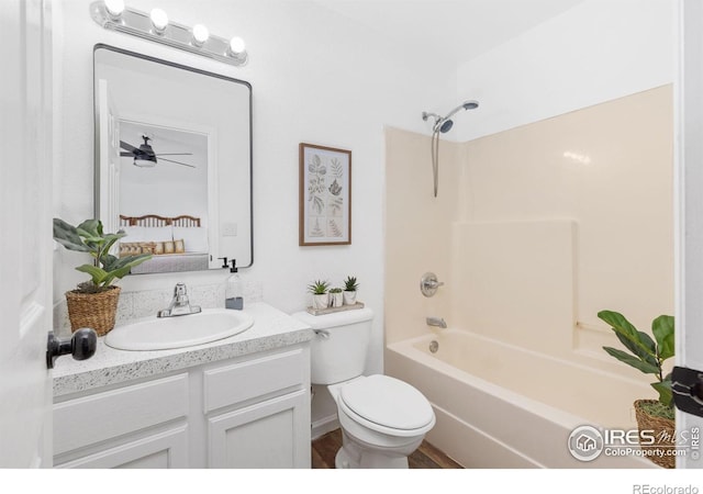 full bathroom with toilet, ceiling fan, shower / bath combination, and vanity