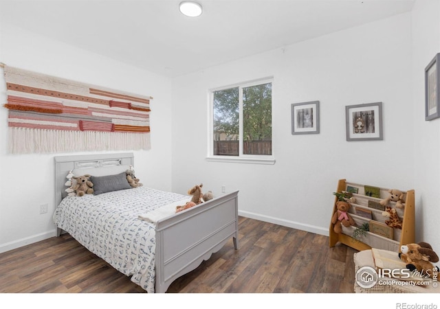 bedroom featuring dark hardwood / wood-style flooring