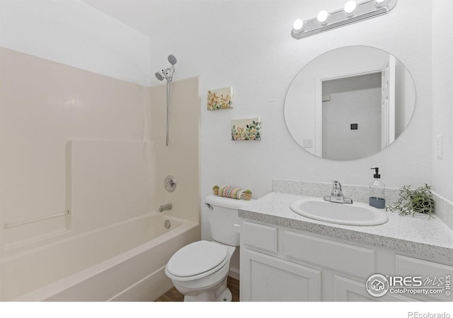 full bathroom with bathtub / shower combination, toilet, and vanity