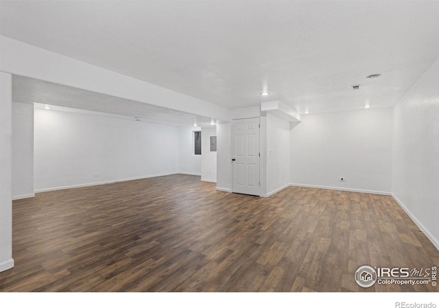 basement with dark wood-type flooring