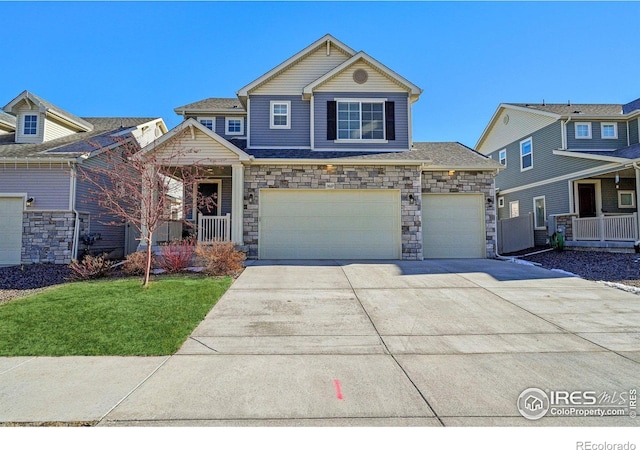 view of front of house with a garage and a front yard